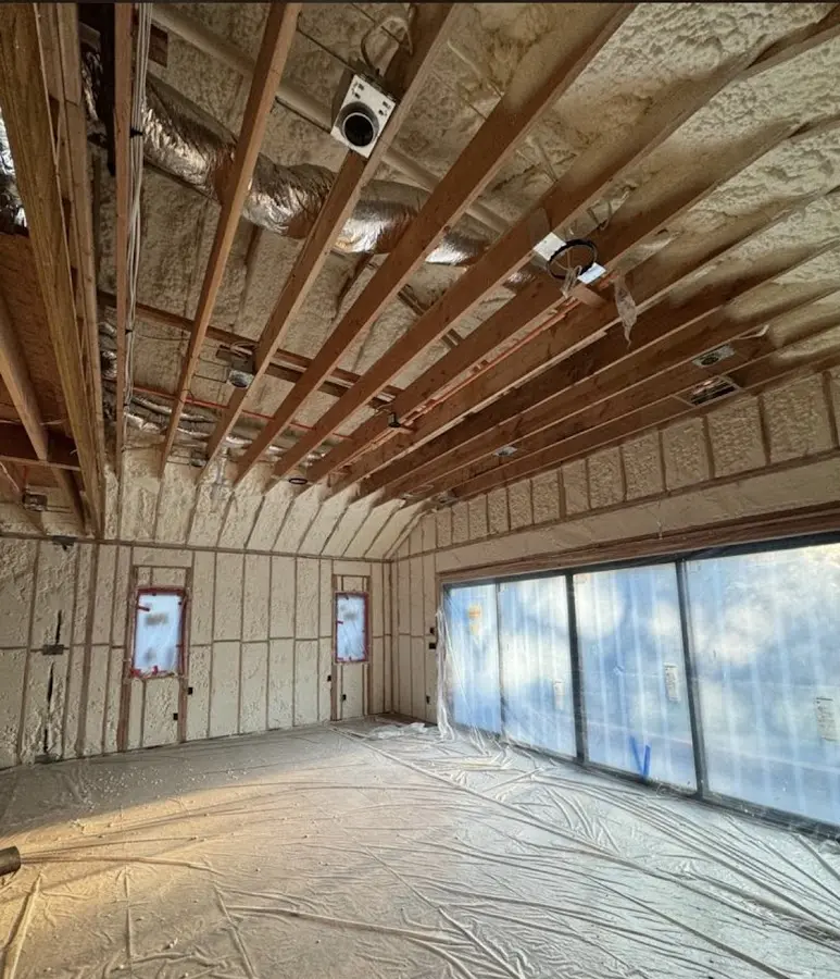 Interior walls and ceiling insulated with spray foam during new construction in Bellview